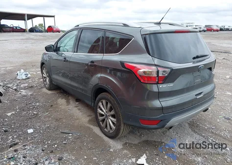 2017 Ford Escape Titanium z USA, uszkodzony, nr VIN 1FMCU0J93HUB62140